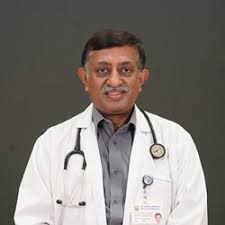 Dr Oommen K George